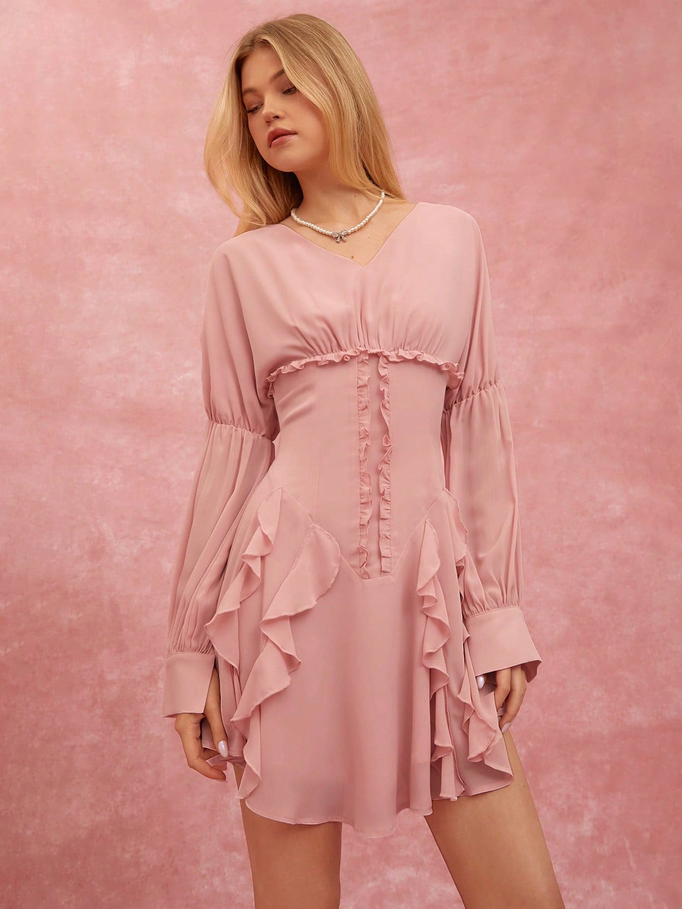 Effortlessly exude style in our Chic & Charming V-Neck Ruffle Hem Mini Dress. A flirty v-neck and playful ruffle hem add a touch of charm to this versatile dress. Perfect for any occasion, this dress is sure to be a staple in your wardrobe.