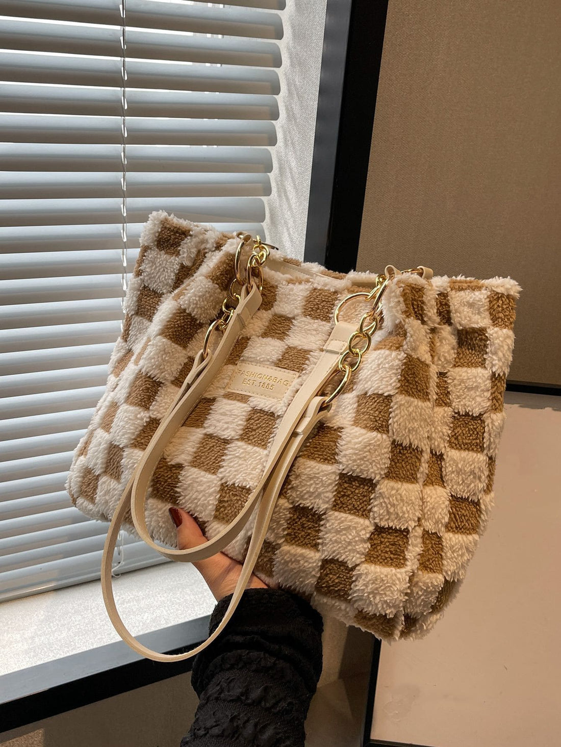 Elevate your professional and student style with our Chic Checkered Fuzzy Shoulder Tote Bag. The perfect accessory for any outfit, this bag combines fashion and functionality with its soft, touchable texture and spacious interior. Stay organized and stylish on-the-go with this must-have tote.
