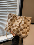 Elevate your professional and student style with our Chic Checkered Fuzzy Shoulder Tote Bag. The perfect accessory for any outfit, this bag combines fashion and functionality with its soft, touchable texture and spacious interior. Stay organized and stylish on-the-go with this must-have tote.