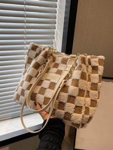 Elevate your professional and student style with our Chic Checkered Fuzzy Shoulder Tote Bag. The perfect accessory for any outfit, this bag combines fashion and functionality with its soft, touchable texture and spacious interior. Stay organized and stylish on-the-go with this must-have tote.
