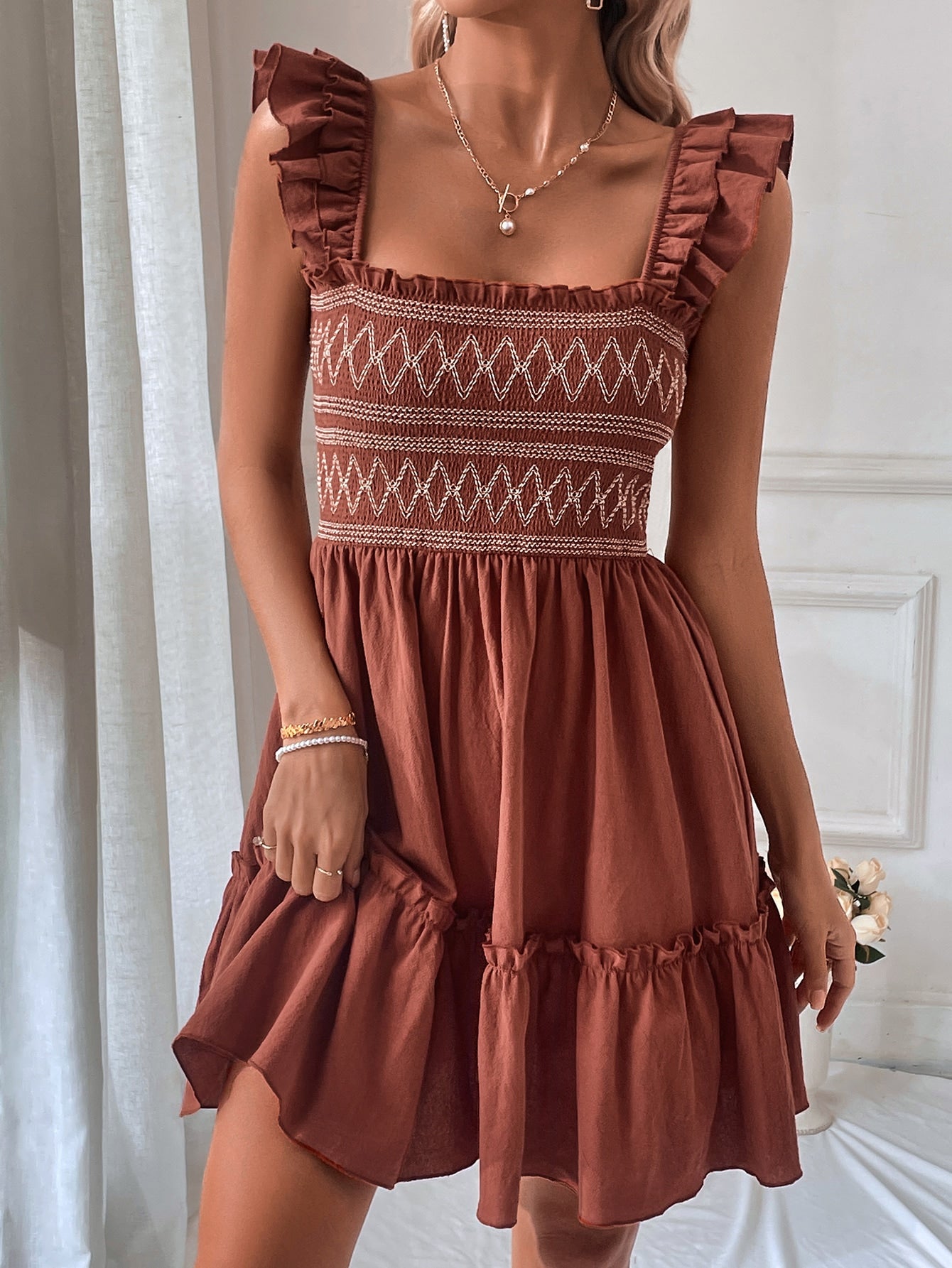 This Chic Chevron Print Ruffle Trim Dress is the perfect addition to any wardrobe. With a stylish chevron print and delicate ruffle trim, this dress is perfect for any occasion. Its versatile design allows you to dress it up or down for maximum flexibility. Available in multiple sizes to ensure the perfect fit.