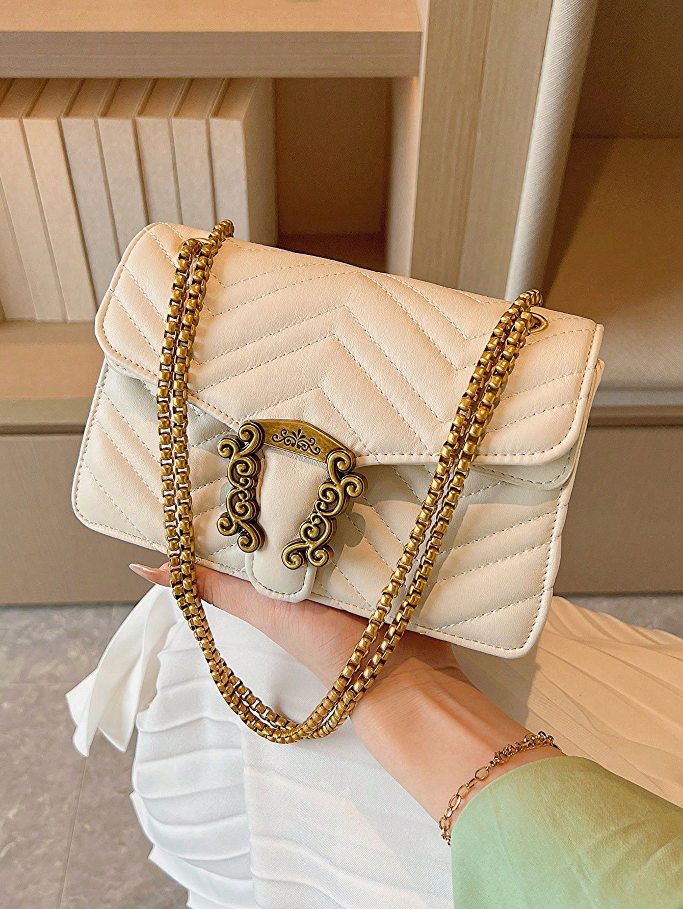 Experience chic and modern style with our Chevron Quilted Mini Bag. The metal accents and chain strap add a touch of luxury while the quilted design adds texture and dimension. Stay effortlessly stylish on-the-go with this must-have accessory.