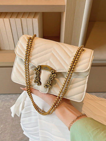 Experience chic and modern style with our Chevron Quilted Mini Bag. The metal accents and chain strap add a touch of luxury while the quilted design adds texture and dimension. Stay effortlessly stylish on-the-go with this must-have accessory.