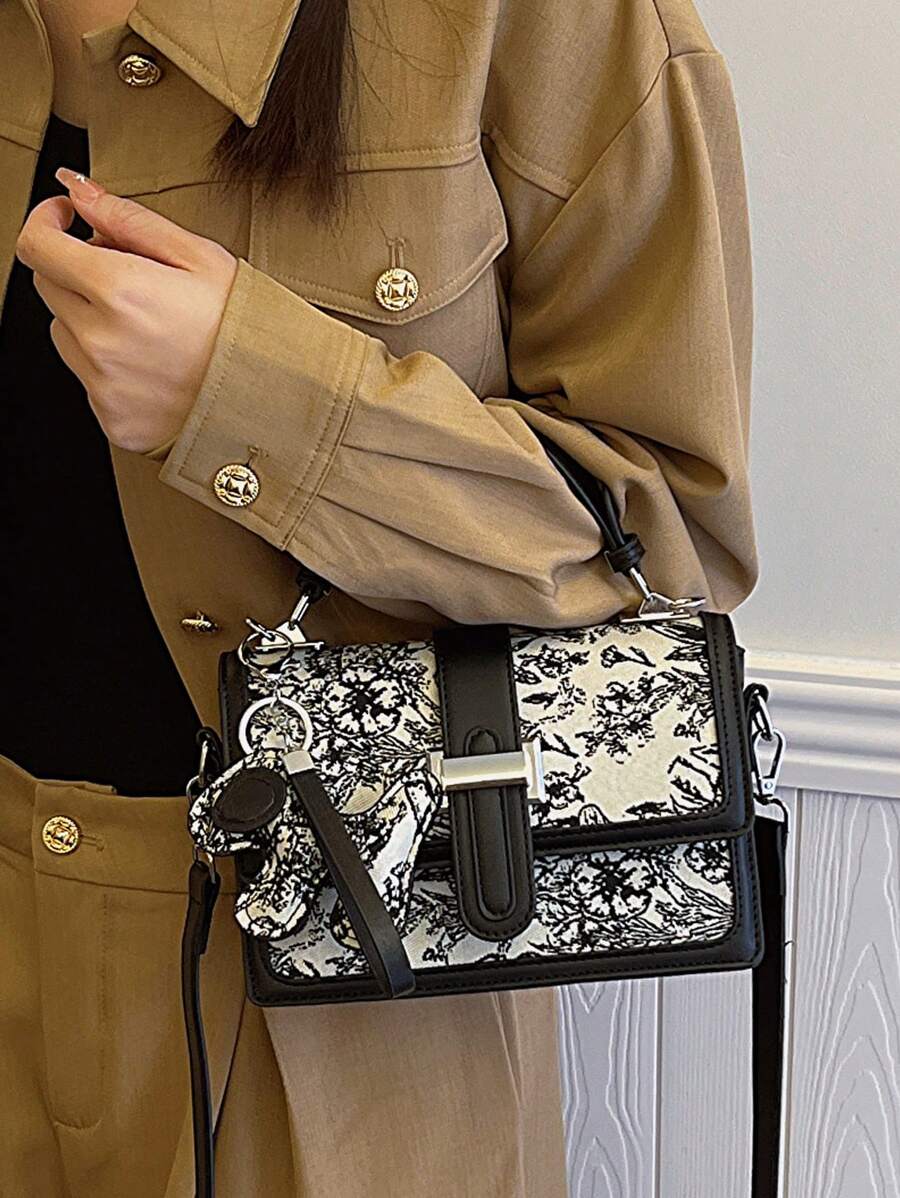 Black and white floral structured handbag with top handle
