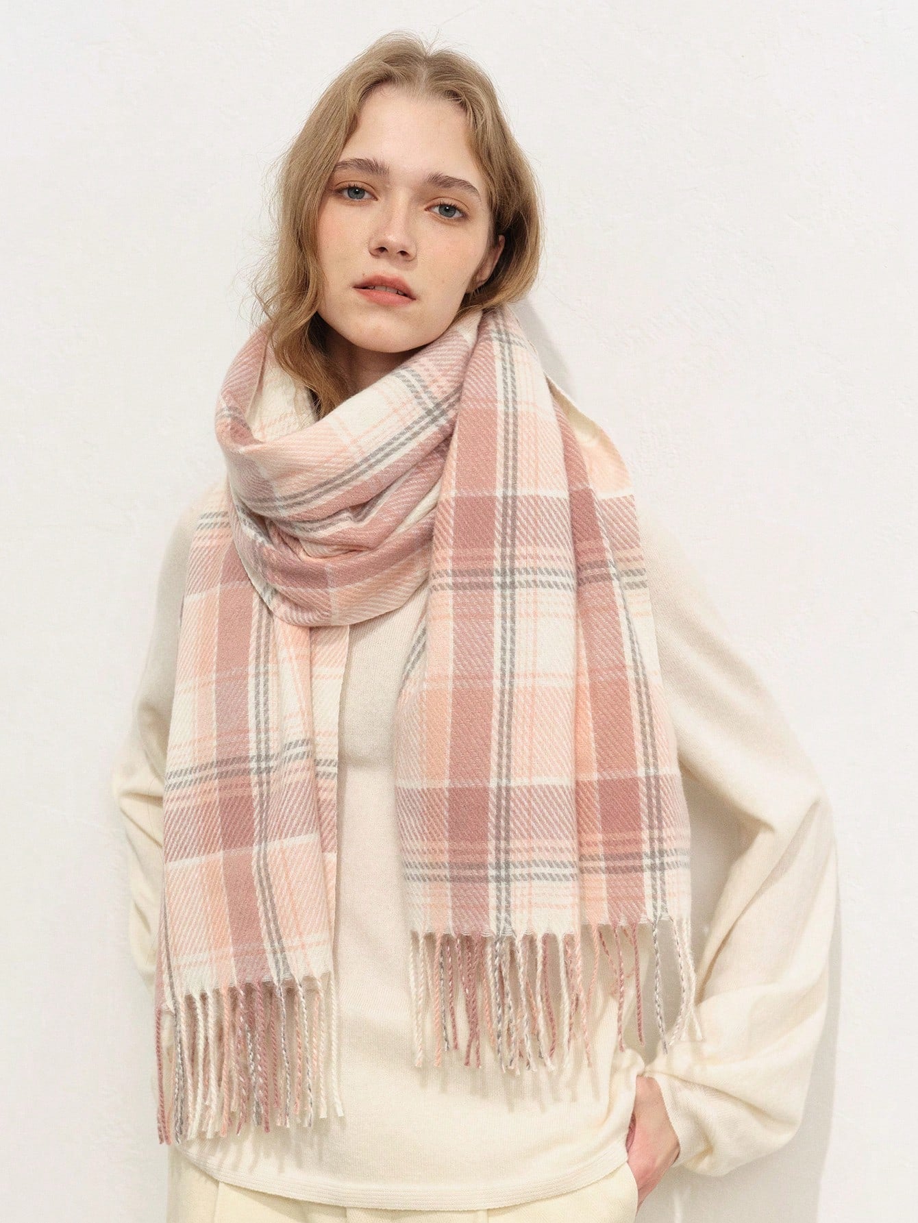 Elevate your style this season with the Chic Classic Plaid Scarf. Crafted with timeless plaid design, this scarf adds a touch of elegance and warmth to your autumn and winter outfits. Made from high-quality materials, this scarf is a must-have accessory for any fashion-savvy individual.
