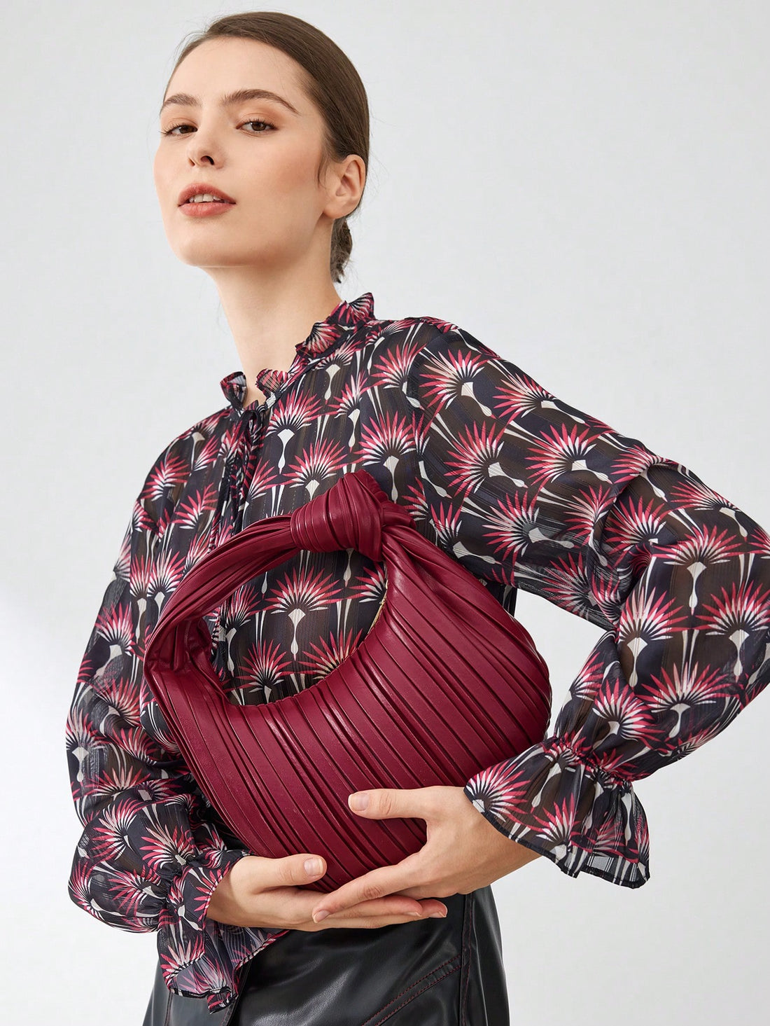Experience elevated style with the premium Chic Cloud Pleated Handbag. The pleated design adds a touch of sophistication while the solid color allows for versatile styling. Made with high-quality materials, this handbag is the perfect accessory to elevate any outfit.
