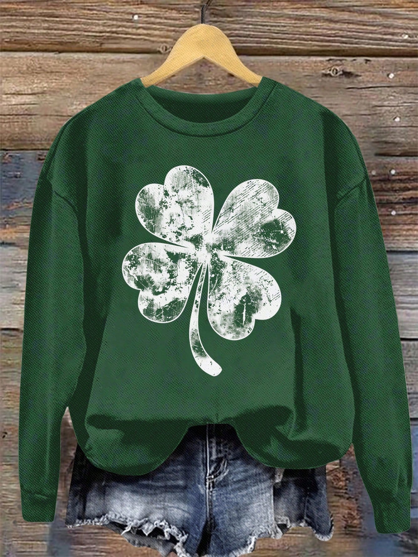 Effortlessly elevate your casual outfits with our Chic Clover Print Sweatshirt. This minimalist style features a playful clover print, adding a touch of whimsy to any look. Perfect for those who don't take themselves too seriously!