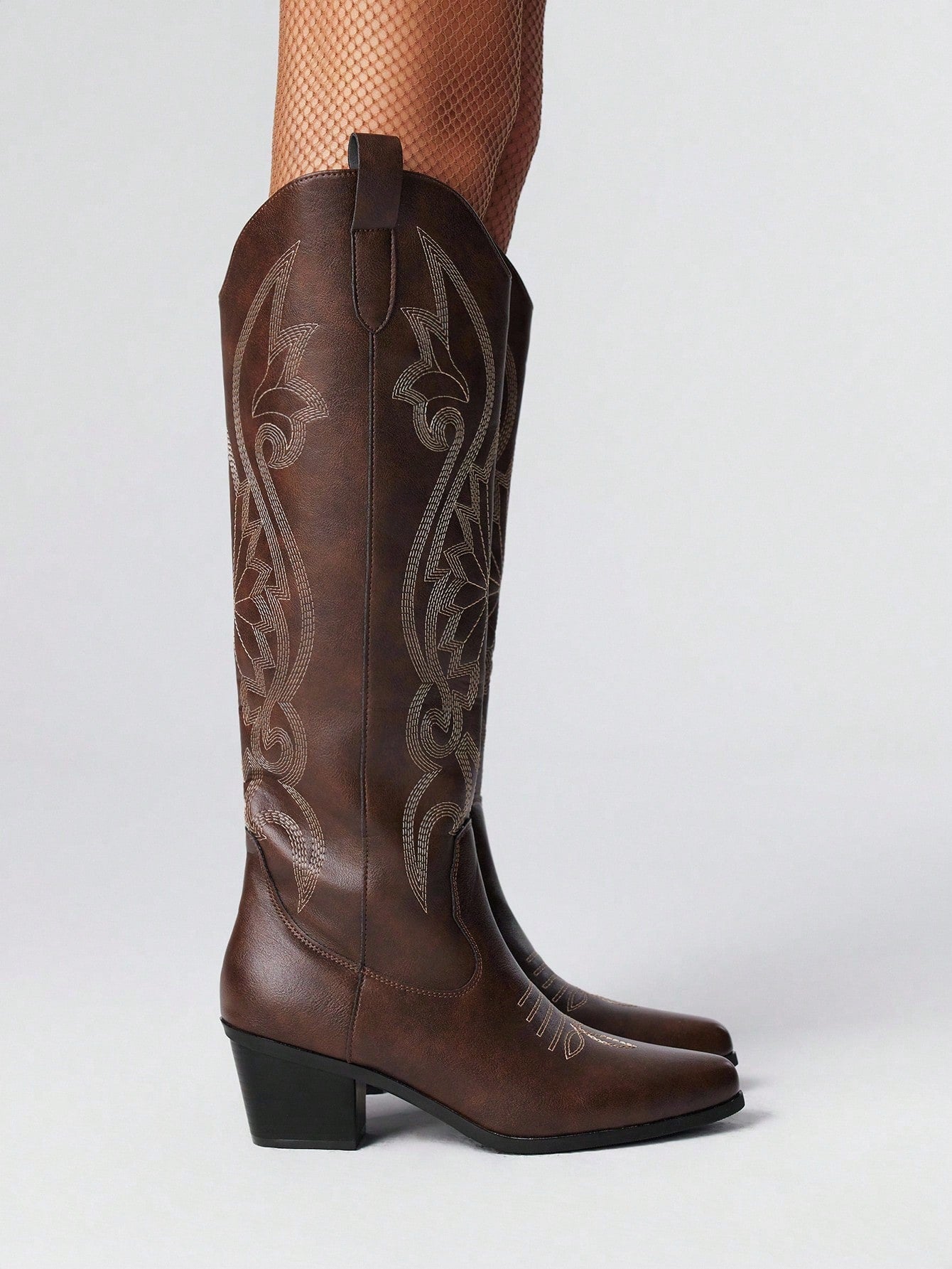 Step into whimsical charm with these Chic Coffee Brown Embroidered Knee-High Boots. Perfect for spring and autumn, their Mori-inspired style brings a cozy yet spirited vibe to your wardrobe. The intricate embroidery adds a delightful touch while the knee-high design keeps you stylishly snug. Whether wandering city streets or forest trails, these boots make every step an adventure.