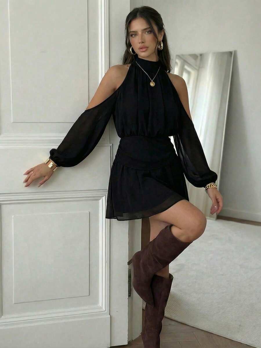 Effortless elegance meets modern style with this cold shoulder mini dress. The tie neck detail adds a playful touch while the off-shoulder design creates a flattering silhouette perfect for warm weather. Crafted in classic black, it transitions seamlessly from casual daytime looks to evening outings. The mini length keeps things fresh and contemporary, making it an essential piece for any summer wardrobe. Pair with sandals for a relaxed vibe or heels for a night out.