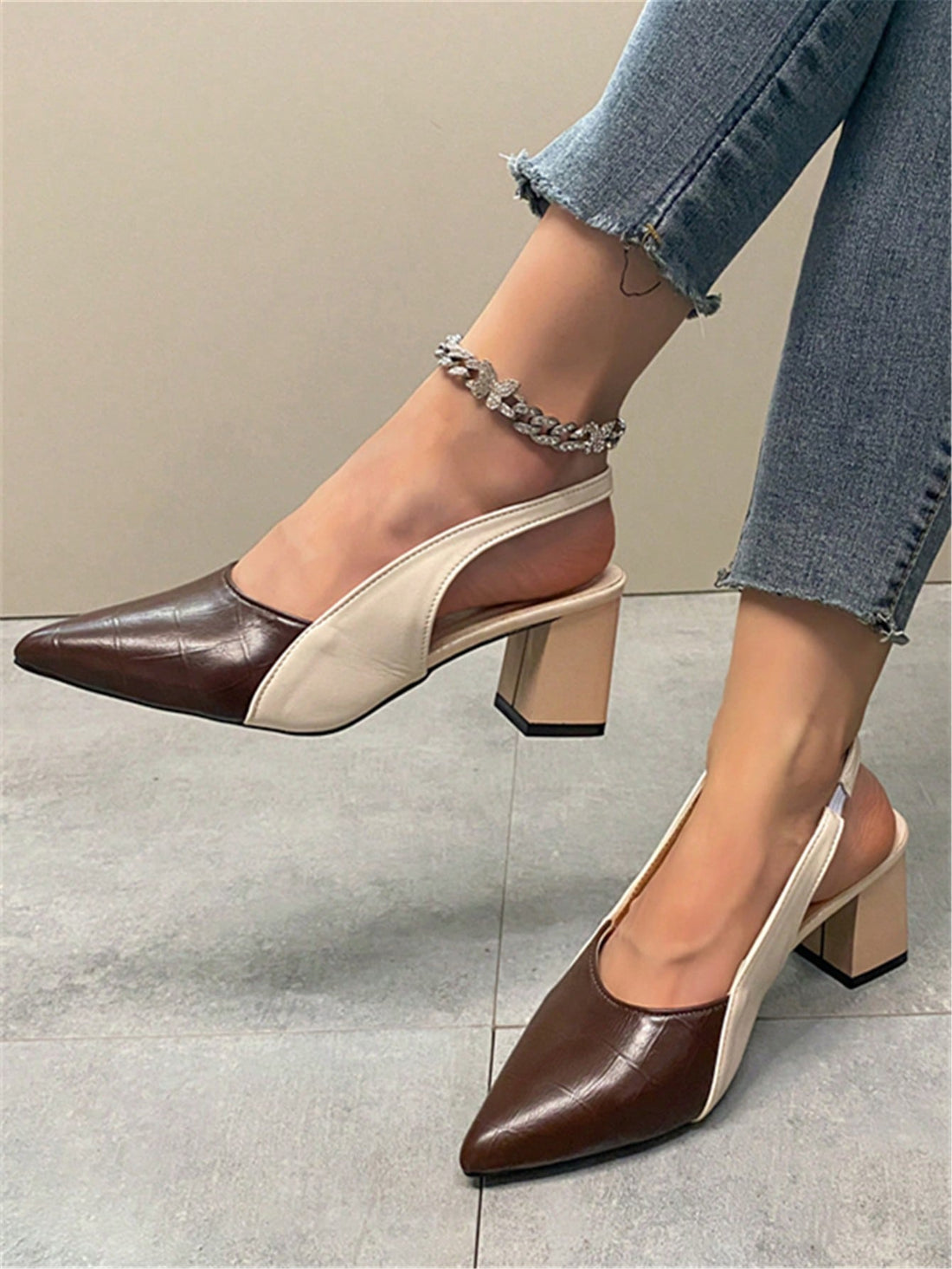 Elevate your style with our Chic Color-Blocked Peep-Toe Stiletto Sandals, perfect for elegant occasions. The unique color-blocking design adds a touch of sophistication, while the peep-toe and stiletto heel provide a flattering and feminine look. Step into these sandals and make a statement that exudes confidence and elegance.