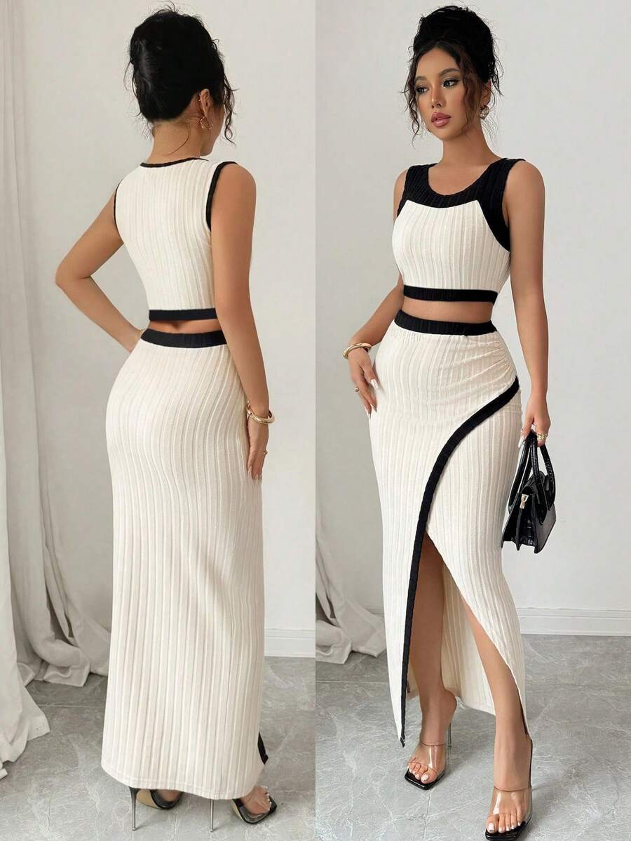 Elevate your wardrobe with this stunning two-piece set featuring a fitted colorblock camisole paired with a pleated bodycon skirt. The camisole showcases a classic round neckline and slim fit silhouette, while the long skirt features a dramatic high slit for modern flair. Crafted from a premium blend of 81% polyester, 15% viscose, and 4% elastane, this high-stretch fabric moves with you for all-day comfort. The apricot colorway adds warmth and sophistication to any occasion. Perfect for casual outings or sp