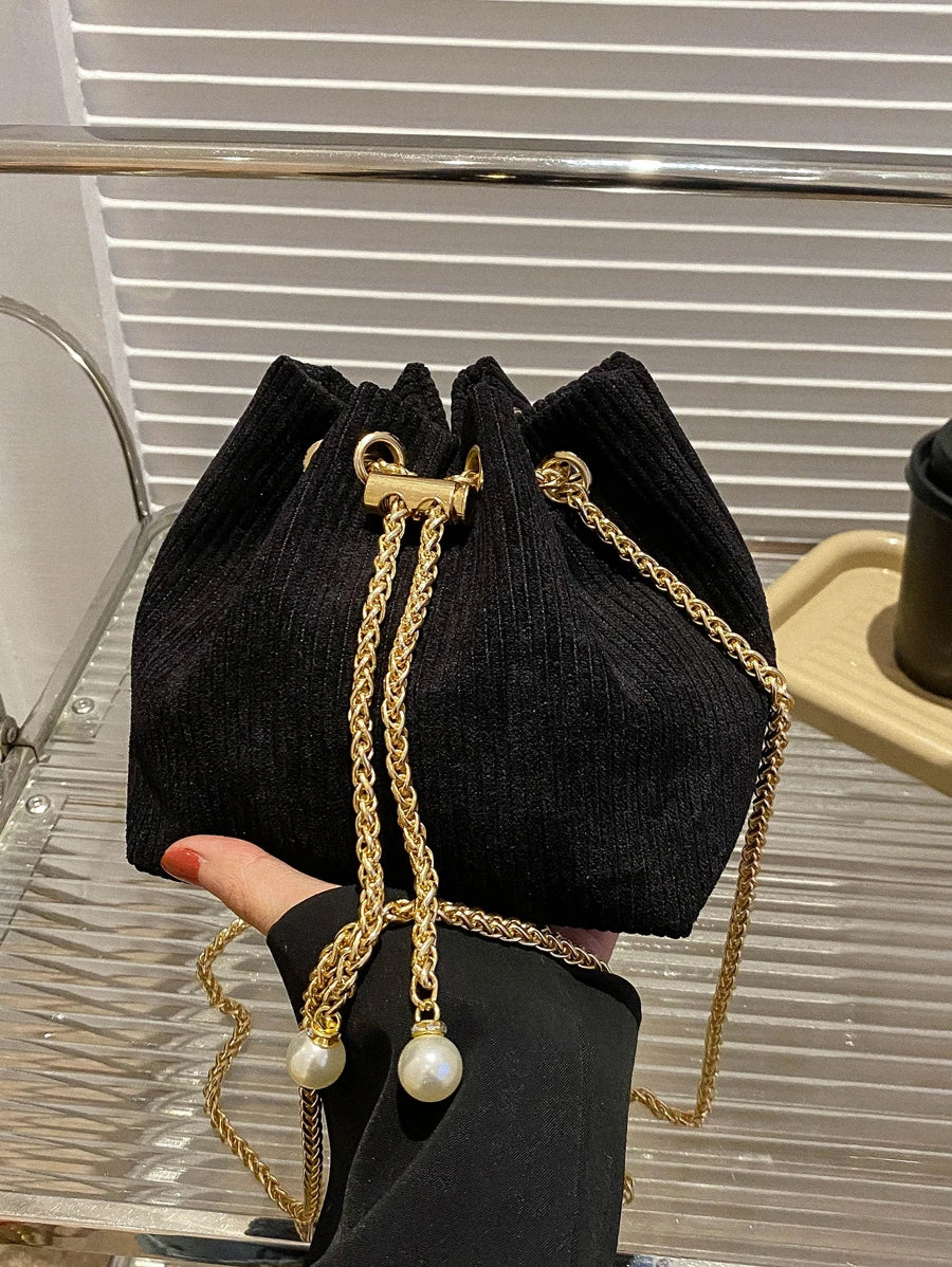 Add a pop of playful charm to your outfit with this Chic Colorblock Mini Bucket Crossbody Bag. Featuring vibrant colorblocking and delicate floral embroidery, this little bag brings a fresh, fun vibe everywhere you go. The sleek chain strap adds just the right amount of edge, making it perfect for day-to-night adventures while keeping your essentials close and your style on point.