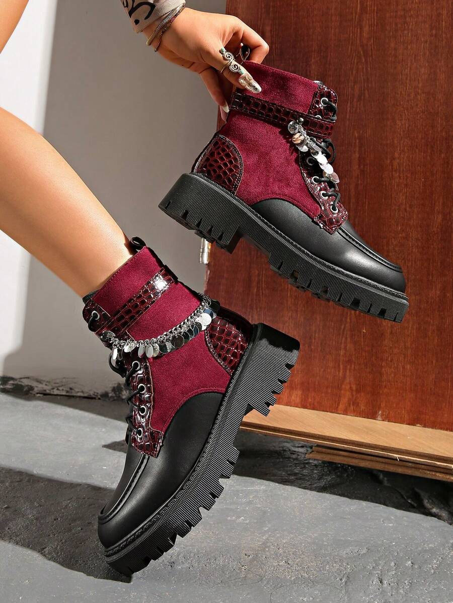 Step into bold style with these Chic Colorblock Punk Ankle Boots, where edgy meets elegant. Featuring striking colorblock design and industrial metal eyelets, these boots command attention from every angle. The convenient side zipper makes them easy to slip on, while the punk-inspired aesthetic adds attitude to any outfit. Perfect for those who refuse to blend in, these ankle boots deliver attitude and comfort in one fierce package. Make a statement that's unmistakably you.