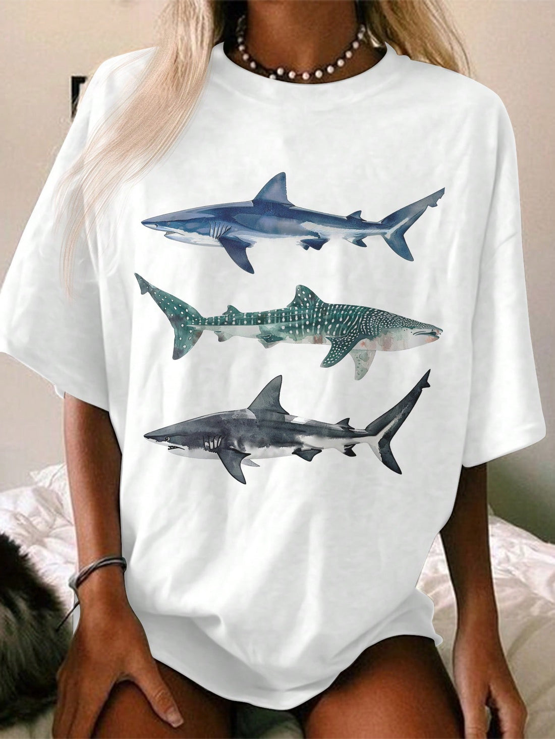 Introducing Chic Comfort: Oversized Minimalist Fish Graphic Tee for Women, the perfect blend of style and comfort. This tee features an oversized fit and a minimalist fish graphic, perfect for those looking for a modern and stylish look. Made with high-quality materials, this tee will provide you with all-day comfort while making a statement. Perfect for any casual occasion, elevate your wardrobe with this trendy tee.