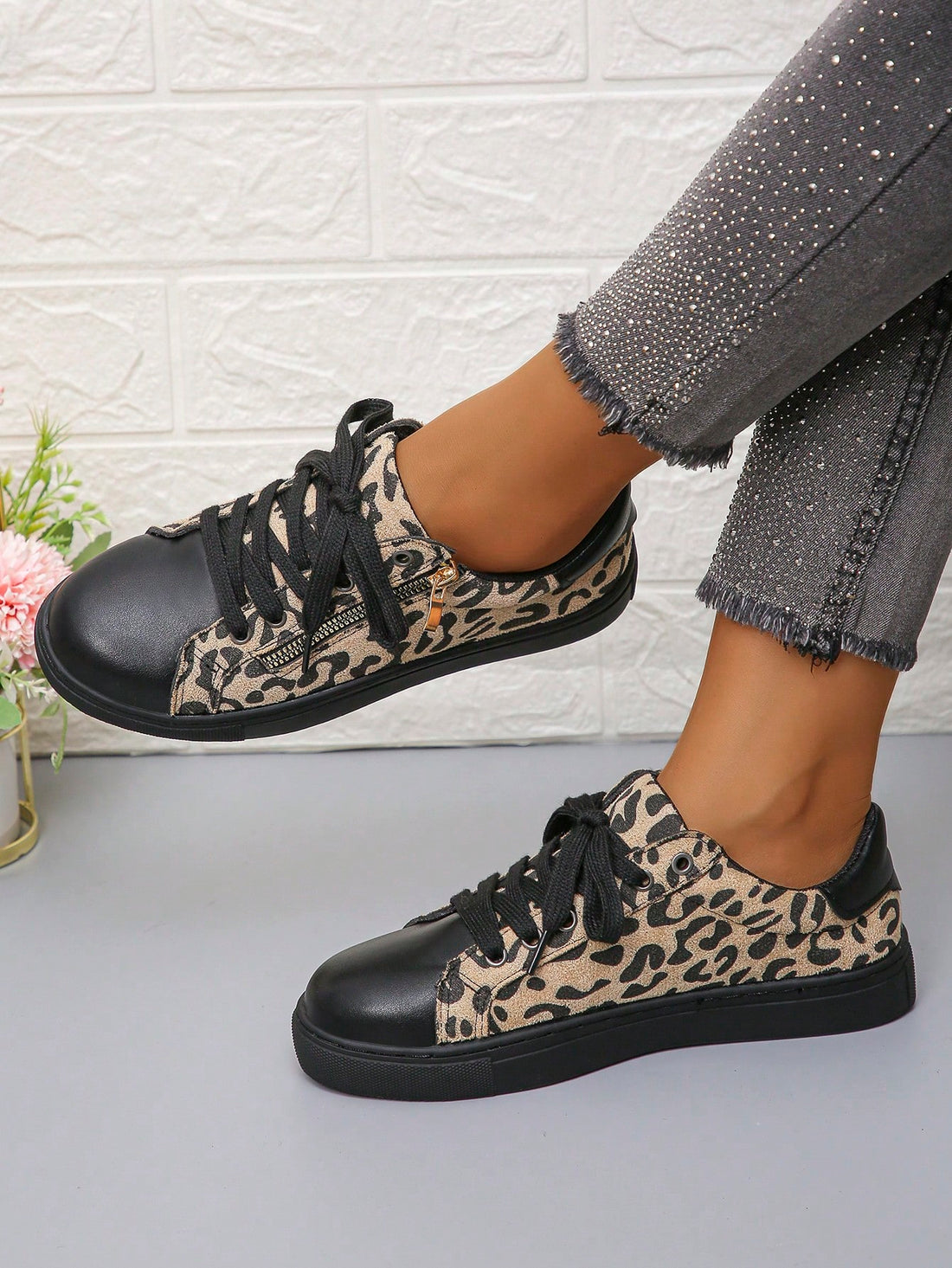 Unleash your wild side with Chic Comfort's Women's Leopard Print Lace-Up Casual Sneakers. These playful kicks feature a side zipper for easy on and off, while the lace-up design ensures a snug and comfortable fit. Perfect for adding a touch of flair to your everyday wardrobe.