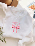 Introducing the ultimate cozy statement piece: Chic Comfort's trendy graphic sweatshirt with a bow tie print design for added flair. Perfect for any stylish woman looking for both comfort and style in one. Stay warm, look cool. (Fun and functional!)