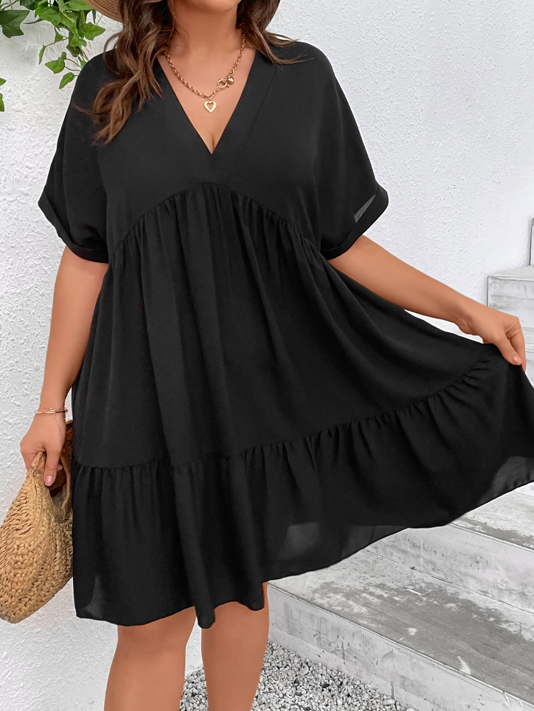 Elevate your style and comfort with our Chic & Comfortable Plus Size Batwing Sleeve Ruffle Hem Smock Dress. Embrace your curves in this trendy and playful dress, perfect for any occasion. The batwing sleeves and ruffle hem add a touch of fun and flair to your wardrobe. (Size inclusive and stylish. Plus size never looked so good!)