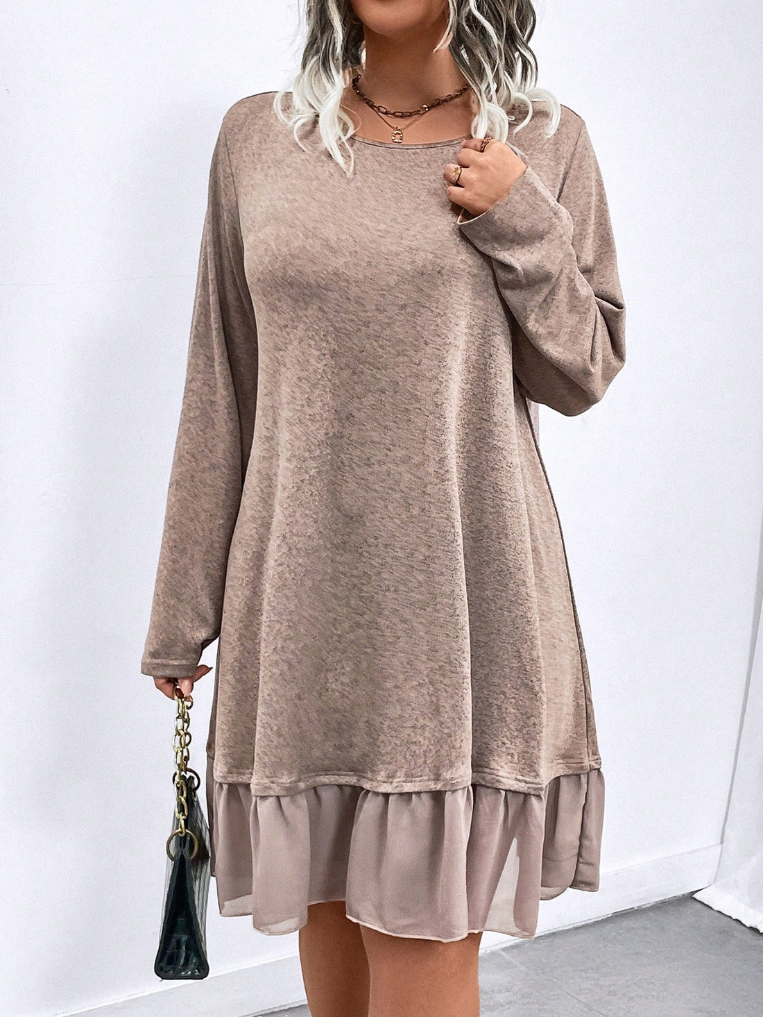 Elevate your wardrobe with our Chic & Comfortable Plus Size Dress. Featuring a solid color and crew neck design, this dress exudes effortless style and sophistication. The ruffle hem adds a touch of femininity, making this dress perfect for any occasion. Experience comfort and style in one elegant piece.