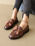 Step out in style and comfort with these chic and comfortable black round toe flat loafers for women. These classic shoes feature a stylish bow accent for an elegant touch. Made with quality materials, these loafers offer both fashion and functionality. Perfect for any occasion, make a statement with every step.