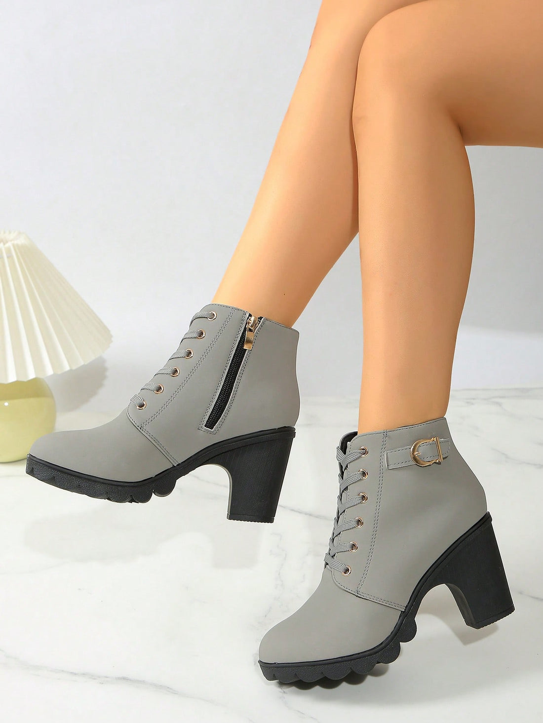 Elevate your style with our Chic & Comfortable Chunky Heel Ankle Boots. These fashion-forward lace-up booties feature a side zipper for easy wear, adding a touch of convenience to your wardrobe. Make a statement with every step in these must-have boots.