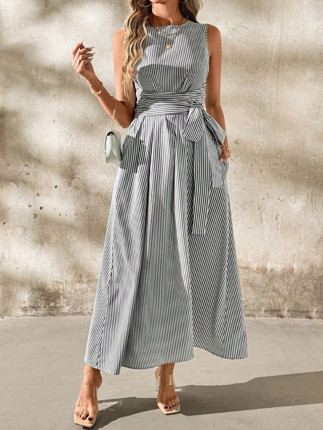 Get ready to be both chic and comfortable in this unique linen stripe dress! With a flattering waist knot and convenient pockets, this dress is perfect for a day out with friends. The classic striped pattern adds a touch of playfulness to your wardrobe.