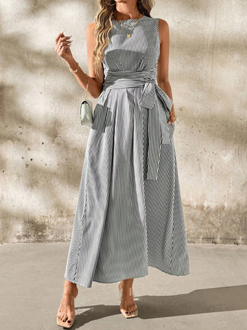 Get ready to be both chic and comfortable in this unique linen stripe dress! With a flattering waist knot and convenient pockets, this dress is perfect for a day out with friends. The classic striped pattern adds a touch of playfulness to your wardrobe.