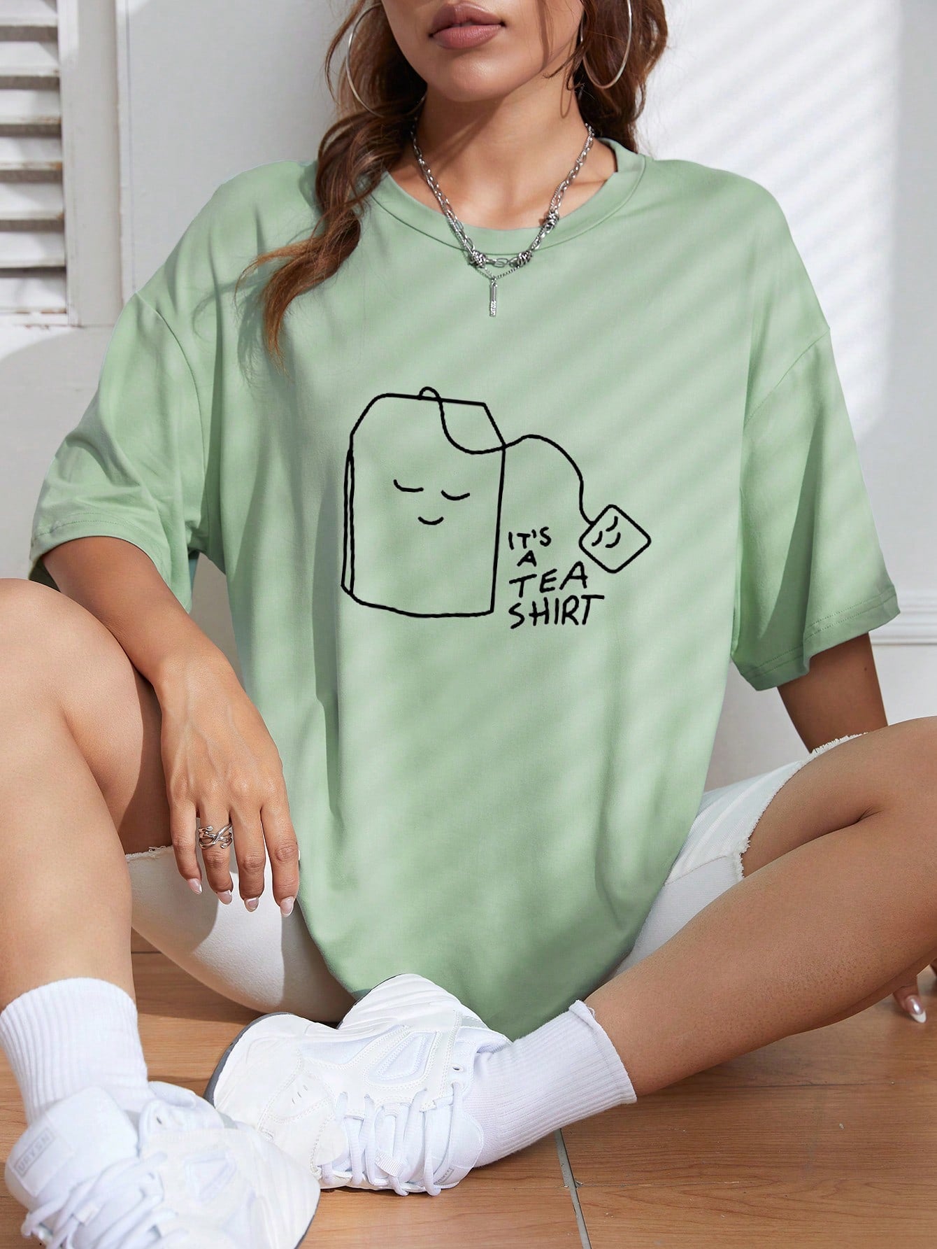 Introducing the 'It's A Tea' edition of our Chic & Comfy Cartoon Graphic Oversized Tee! Soft and stylish, this tee is perfect for any tea lover. With a playful graphic and comfortable fit, you'll be sure to make a statement while staying comfortable. Get yours now!