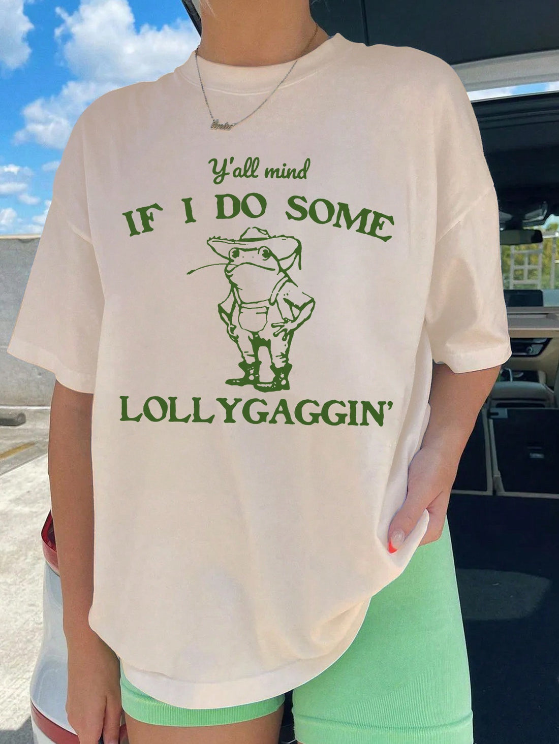 Stay stylish and comfortable all summer long with our Chic & Comfy Cartoon Slogan Dropped Shoulder T-Shirt. Its unique design and lightweight fabric make it perfect for warm weather. Embrace the season in style with this must-have addition to your wardrobe.