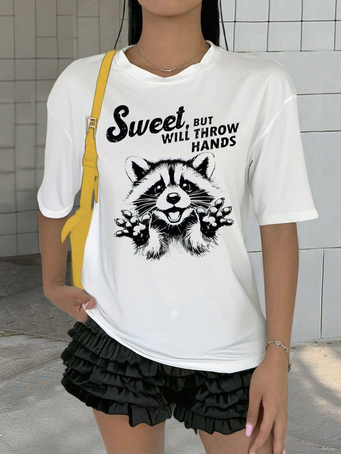 Effortless style and maximum comfort collide in our Chic & Comfy Raccoon Letter Print Tee. The minimalist design showcases the playful charm of these clever creatures, while the soft, lightweight fabric keeps you cool and comfortable all day long. Perfect for any casual occasion, this tee is a must-have for any stylish wardrobe.
