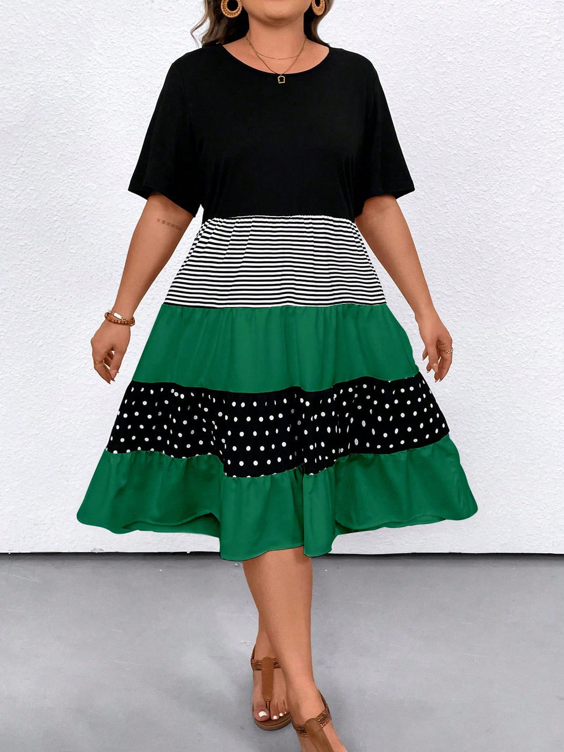 Step into summer with style and comfort in our Chic & Comfy Plus Size Summer Dress. The polka dot striped pattern adds a playful touch to the loose fit design, while the short sleeves keep you cool on those hot days. Look chic and feel comfy all season long!