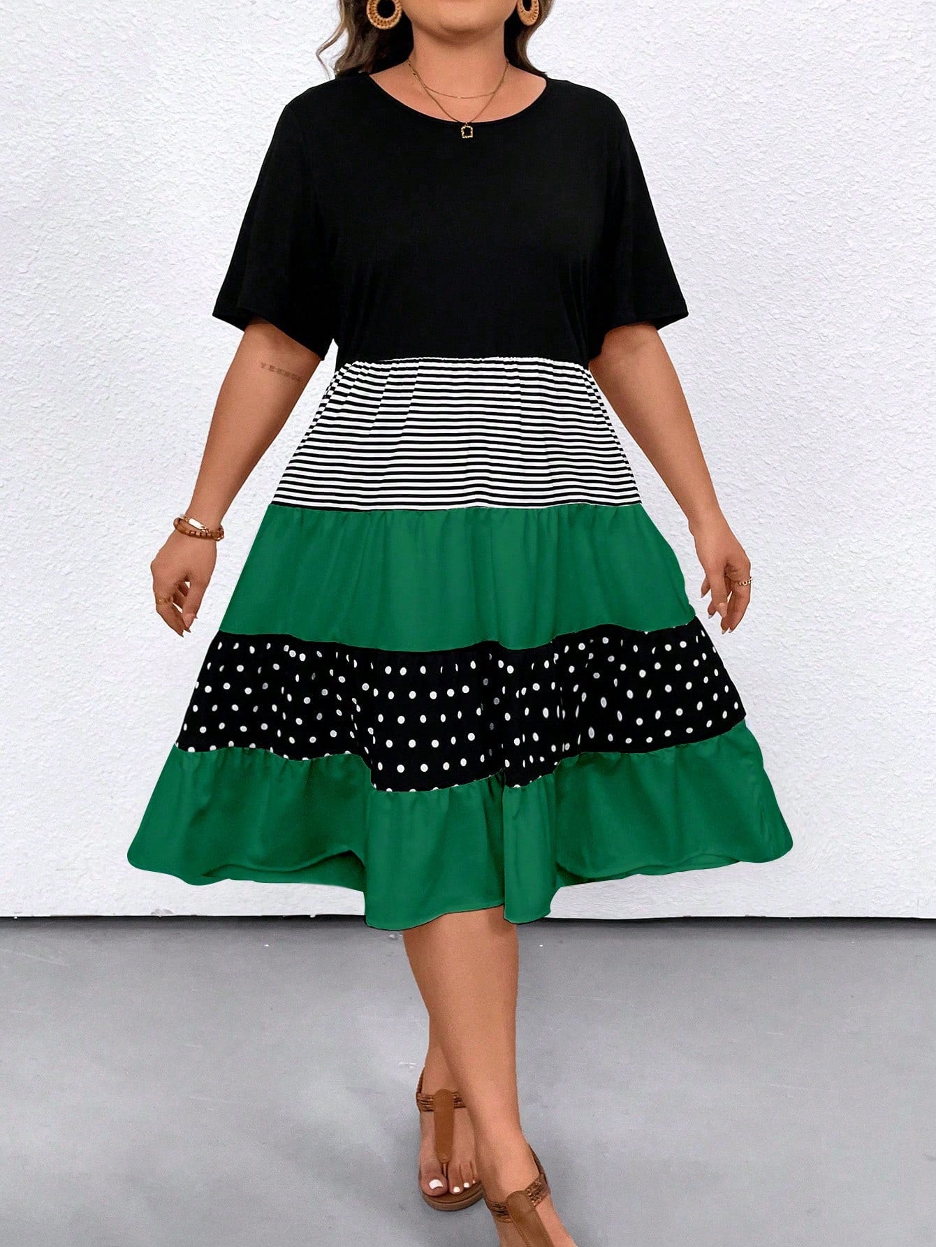 Step into summer with style and comfort in our Chic & Comfy Plus Size Summer Dress. The polka dot striped pattern adds a playful touch to the loose fit design, while the short sleeves keep you cool on those hot days. Look chic and feel comfy all season long!