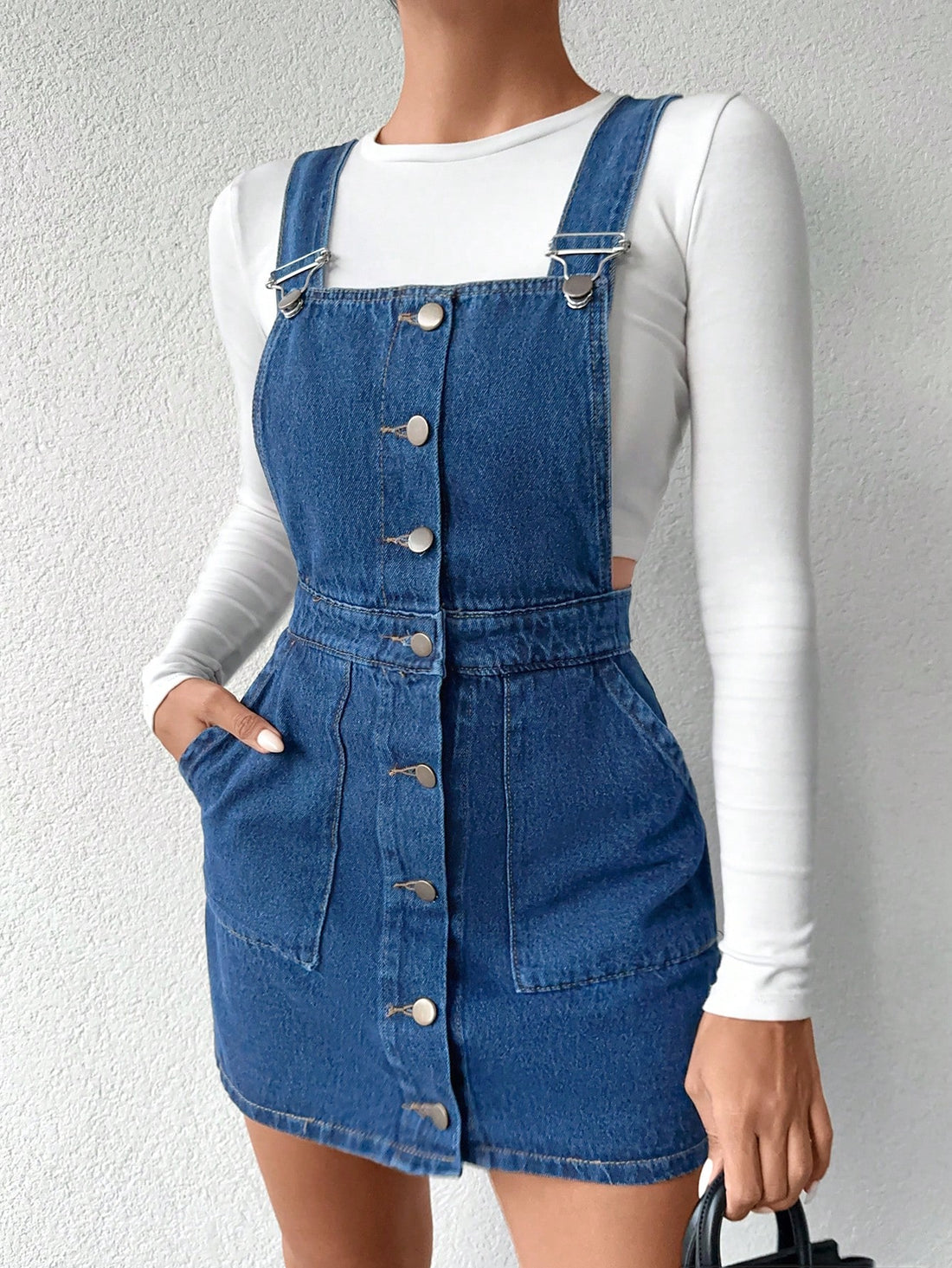 Transform your wardrobe with our Chic Cottonline Slant Pocket Button-Front Denim Overall Dress! The perfect blend of chic and trendy, this dress features a button-front design and slant pockets for convenience. Its soft cotton material is comfortable and stylish. (Seriously, what more could you ask for?!)