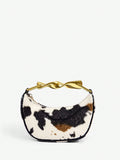 Add a splash of whimsy to your outfit with this Chic Cow Print Top Handle Bag. Perfectly sized for essentials, its charming print brings a fun twist to any look, from casual days out to stylish evenings. Carry it by the top handle for a touch of elegance or let it steal the spotlight as your go-to statement piece!