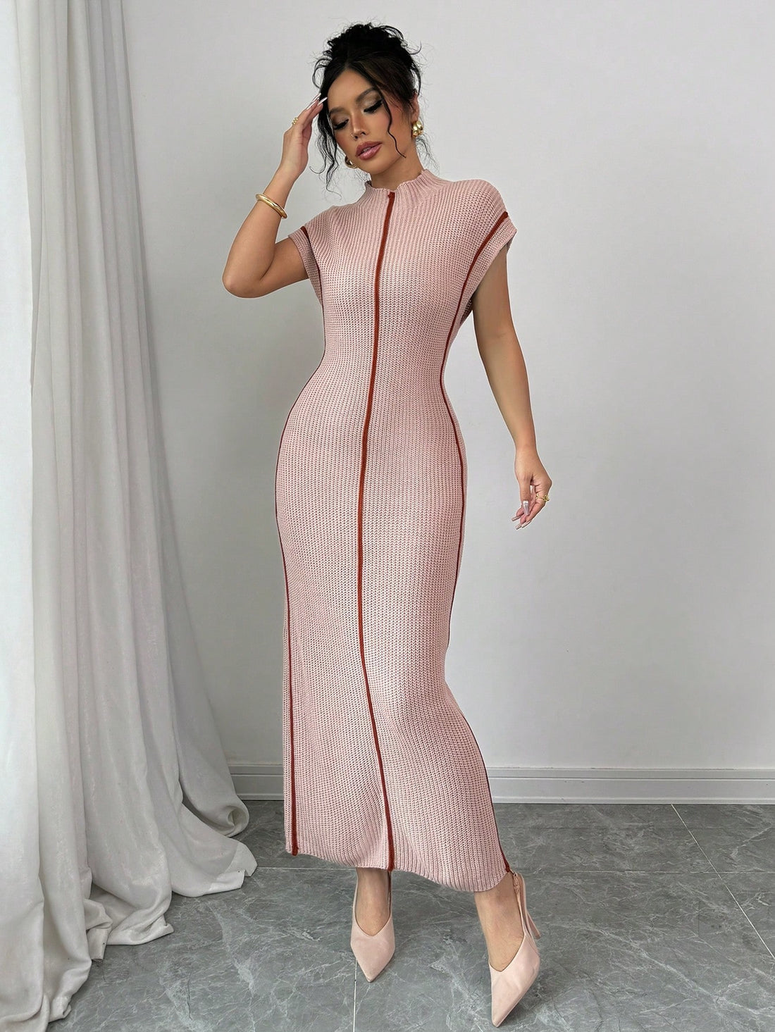 Get ready to turn heads with our Chic & Cozy Sweater Dress! Perfect for Fall & Winter, this sleeveless dress is designed with a high neck and slim fit for a chic and cozy look. Made from quality materials, it's sure to keep you stylish and warm all season long.