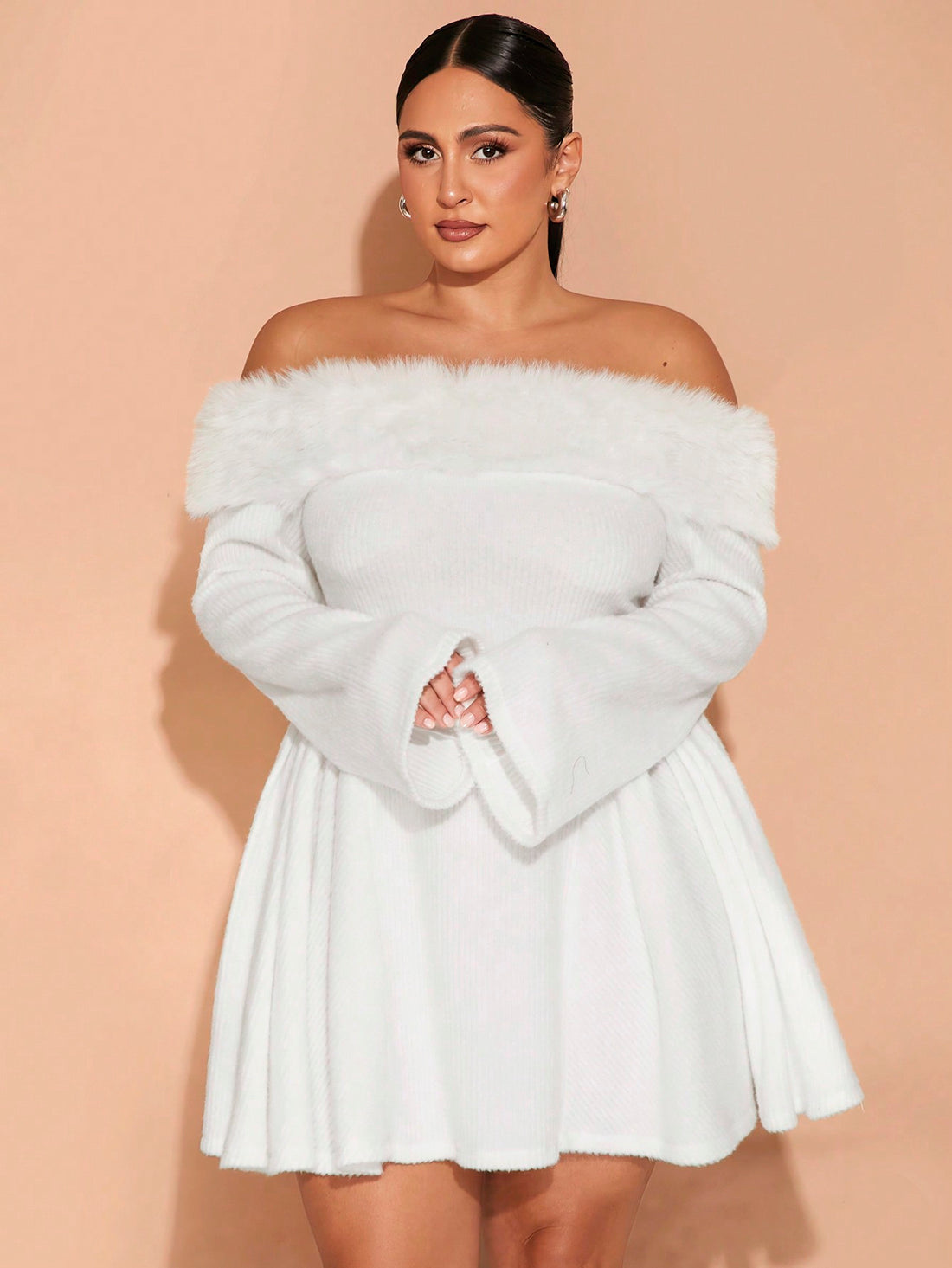 Embrace your curves with our Chic &amp; Cozy: Plus Size Cream Dress! The fluffy trim and ribbed A-hem add a touch of playfulness to this versatile dress, perfect for any occasion. Stay stylish and comfortable with our unique design. (Size options available!)