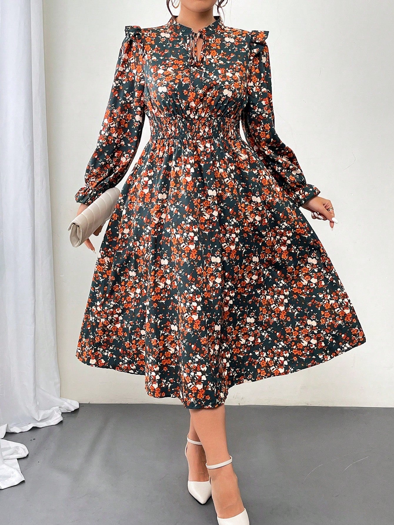 This Chic & Cozy dress is the perfect addition to your fall wardrobe! The plus size fit and ditsy floral pattern are both flattering and stylish. The tie-neck detail adds a touch of elegance, while the long sleeves make it ideal for cooler weather. Stay chic and comfy with this must-have dress.