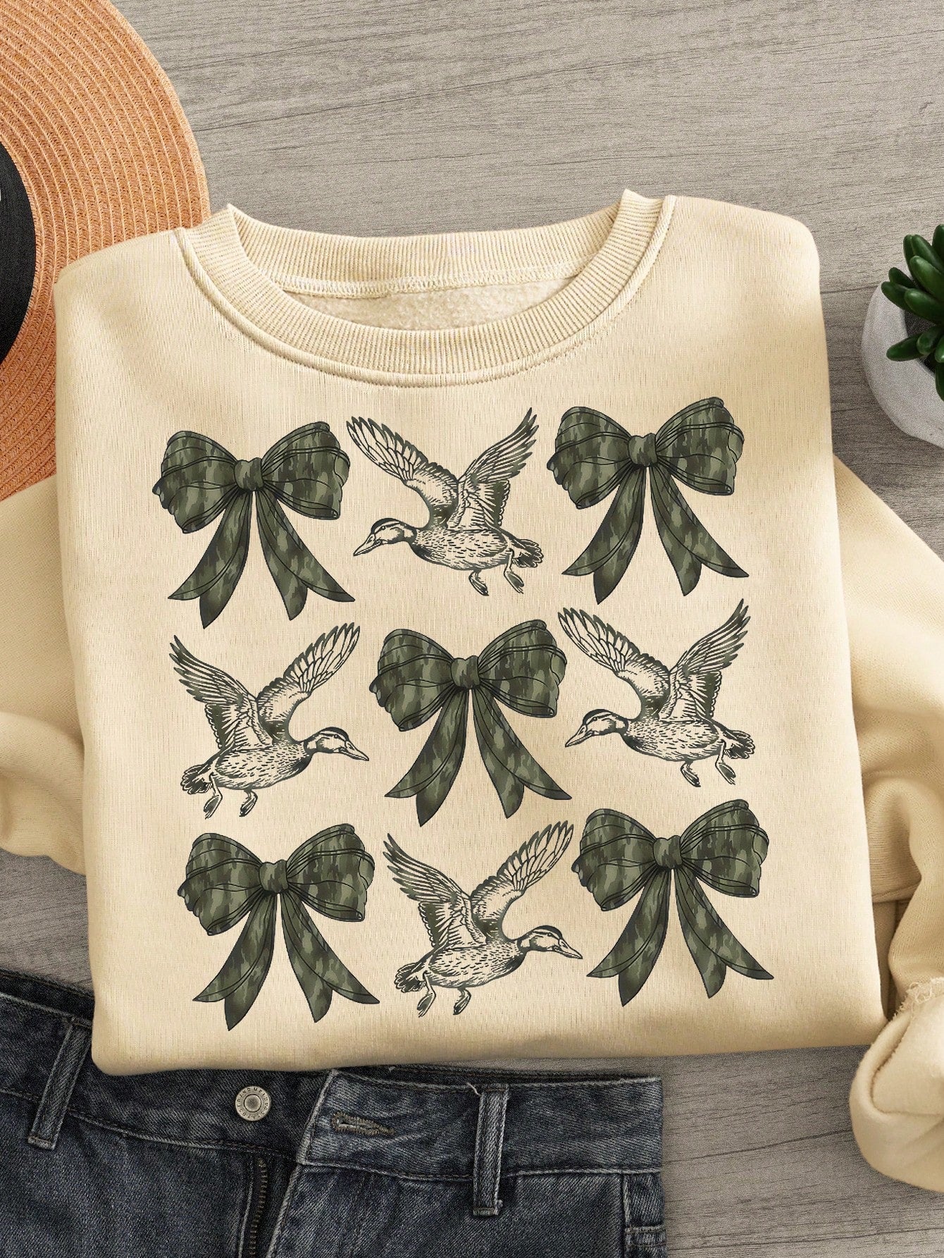 Stay stylish and comfortable with our Chic & Cozy vintage camouflage sweatshirt! This plus size top features a fun and unique duck print, perfect for adding a touch of quirkiness to any outfit. Made with soft, cozy material, this sweatshirt is perfect for staying warm and stylish in any weather.