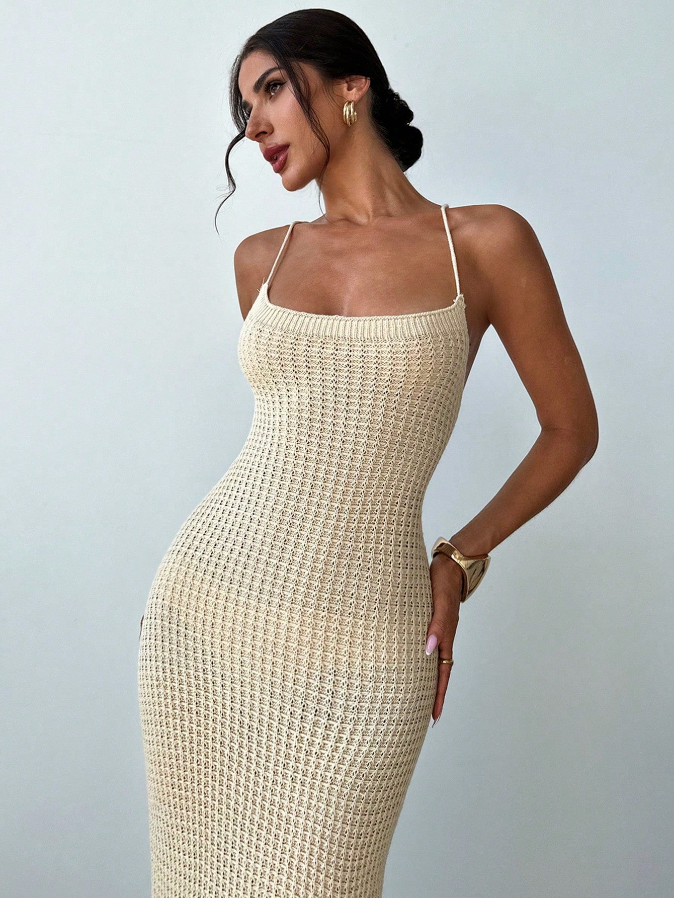 Get ready to turn heads in our Chic Criss-Cross Backless Bodycon Midi Dress! With a playful, criss-cross back design and a sexy side slit, this dress is perfect for any occasion. Let your quirkiness shine through with this unique and stylish dress.