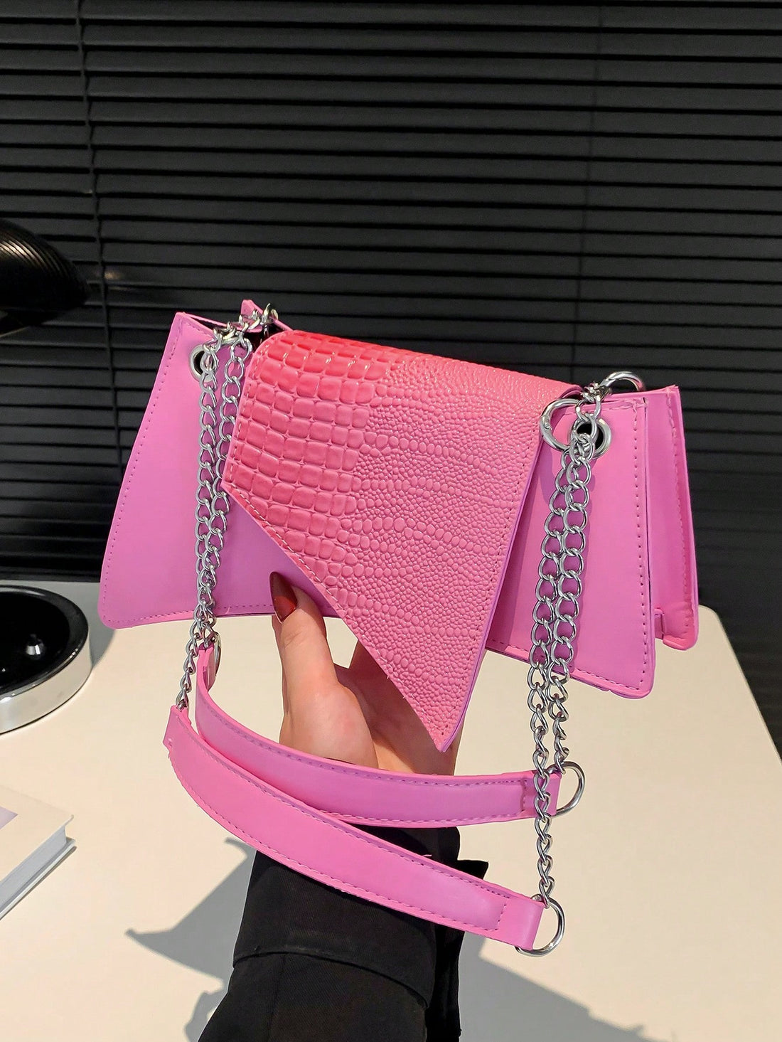 This chic shoulder bag features a stylish crocodile pattern, making it a perfect accessory for any commute, work day, or holiday. Its spacious design allows for convenient storage of all your essentials, while adding a touch of sophistication to your outfit. Made for the modern woman on-the-go.