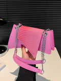 This chic shoulder bag features a stylish crocodile pattern, making it a perfect accessory for any commute, work day, or holiday. Its spacious design allows for convenient storage of all your essentials, while adding a touch of sophistication to your outfit. Made for the modern woman on-the-go.