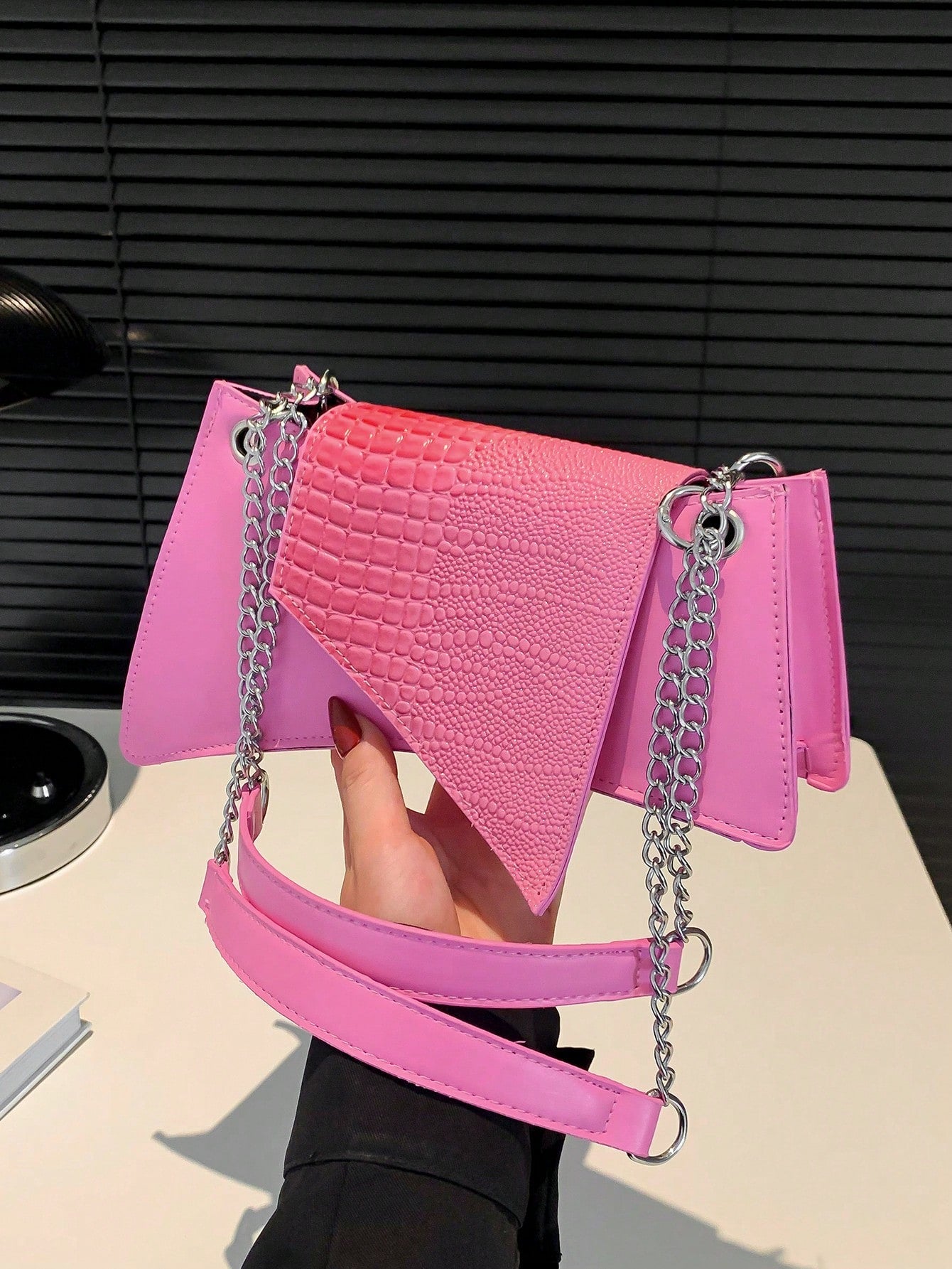 This chic shoulder bag features a stylish crocodile pattern, making it a perfect accessory for any commute, work day, or holiday. Its spacious design allows for convenient storage of all your essentials, while adding a touch of sophistication to your outfit. Made for the modern woman on-the-go.