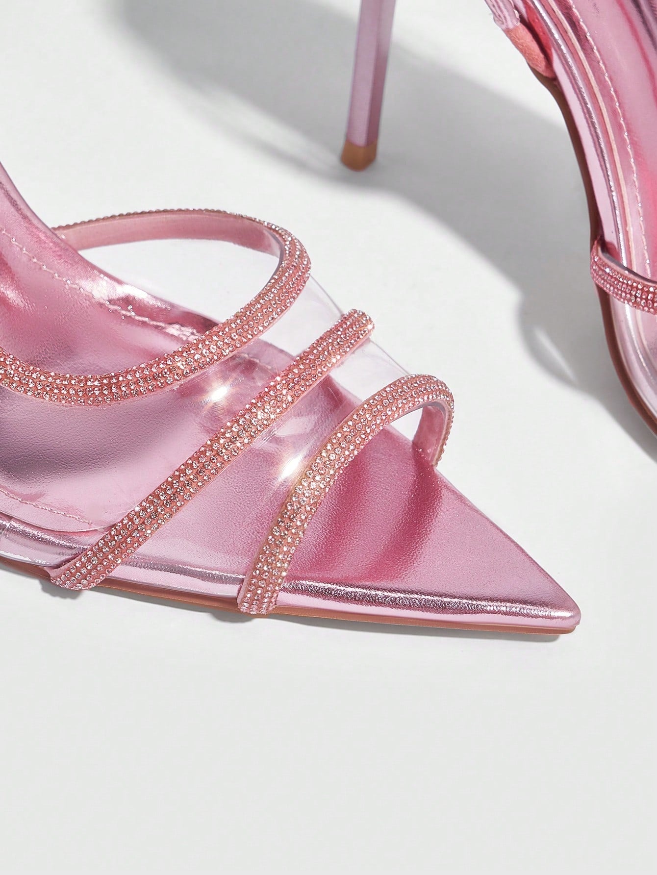 Unleash your inner fashionista with these eye-catching heels. Sleek and transparent PVC stilettos are adorned with shimmering crystals, adding a touch of glam to any outfit. Perfect for any occasion, these pumps will have you strutting your stuff in style. So go ahead, step into these chic pumps and shine!