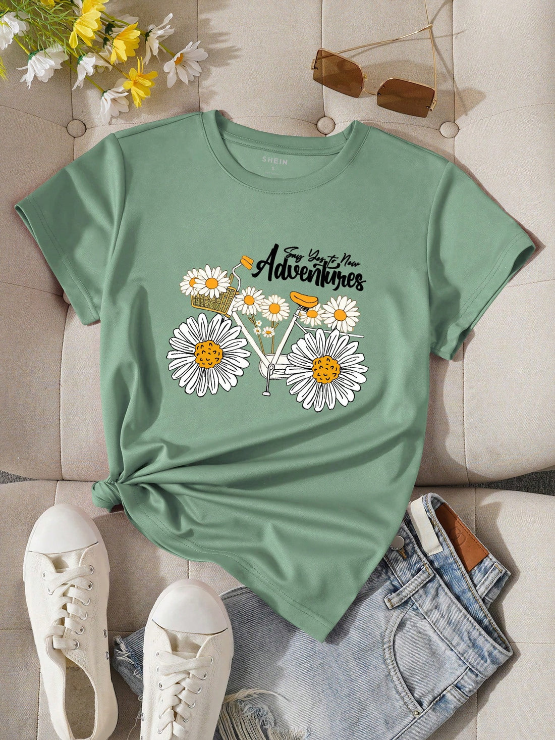 Introducing our Chic Daisy Flower Letter Printed T-Shirt, perfect for adding a touch of effortless style to your wardrobe. Made with high-quality materials, this t-shirt features a stylish daisy flower and letter print that will elevate any outfit. With its comfortable fit and chic design, you'll look and feel your best wherever you go.
