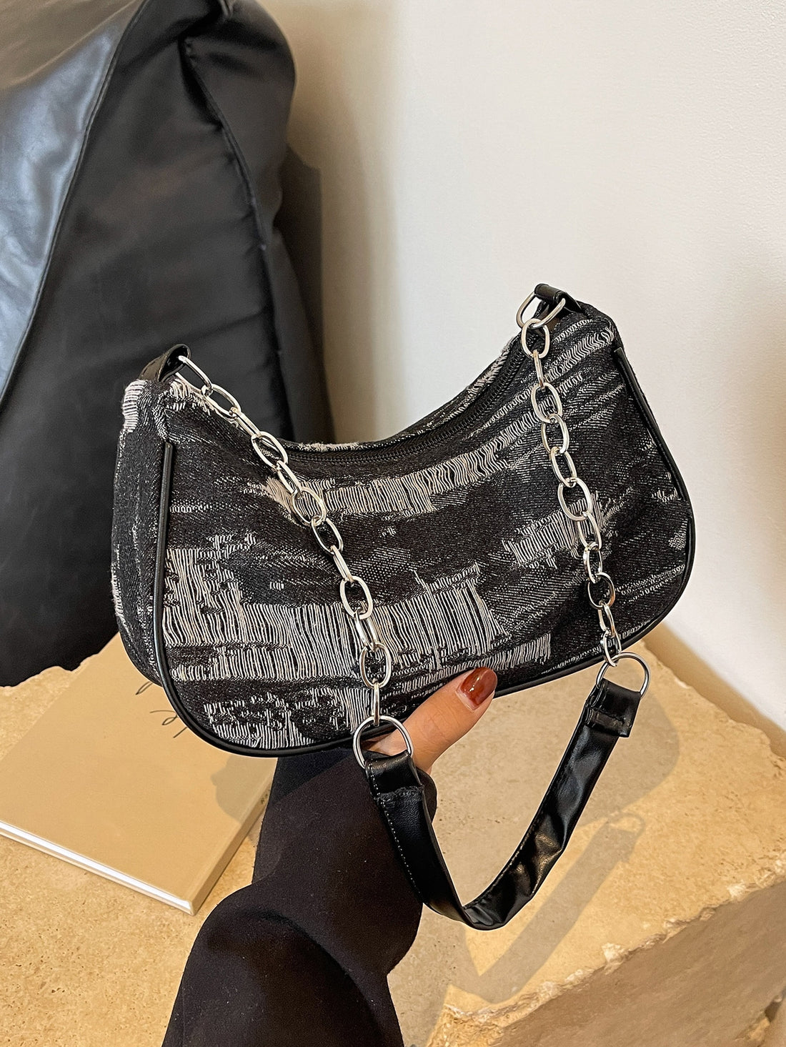 This chic denim chain shoulder bag effortlessly adds style to any occasion. With its versatile design, it's perfect for any outfit. The chain strap adds a touch of sophistication, while the spacious interior offers plenty of room for all your essentials. Elevate your wardrobe with this must-have accessory.