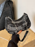 This chic denim chain shoulder bag effortlessly adds style to any occasion. With its versatile design, it's perfect for any outfit. The chain strap adds a touch of sophistication, while the spacious interior offers plenty of room for all your essentials. Elevate your wardrobe with this must-have accessory.