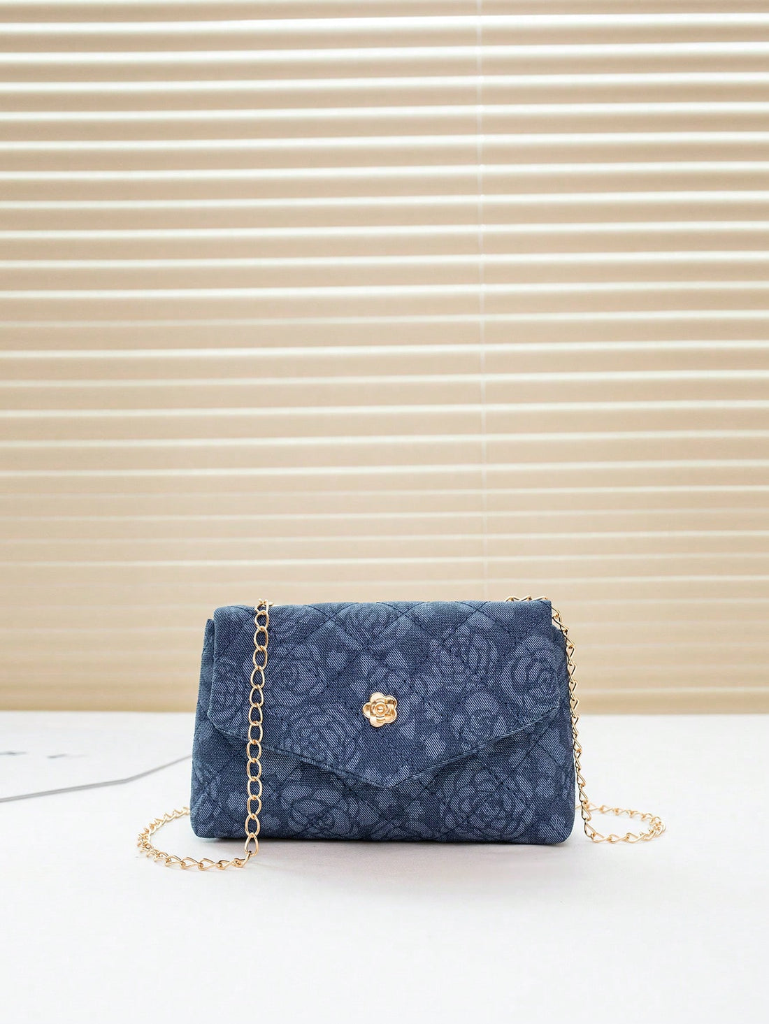 This stylish crossbody bag is the perfect accessory for any fashionable woman. Made from high-quality denim, it offers both durability and style. With its chic flap design, it adds a touch of elegance to any outfit. Stay on-trend and organized with this must-have bag.