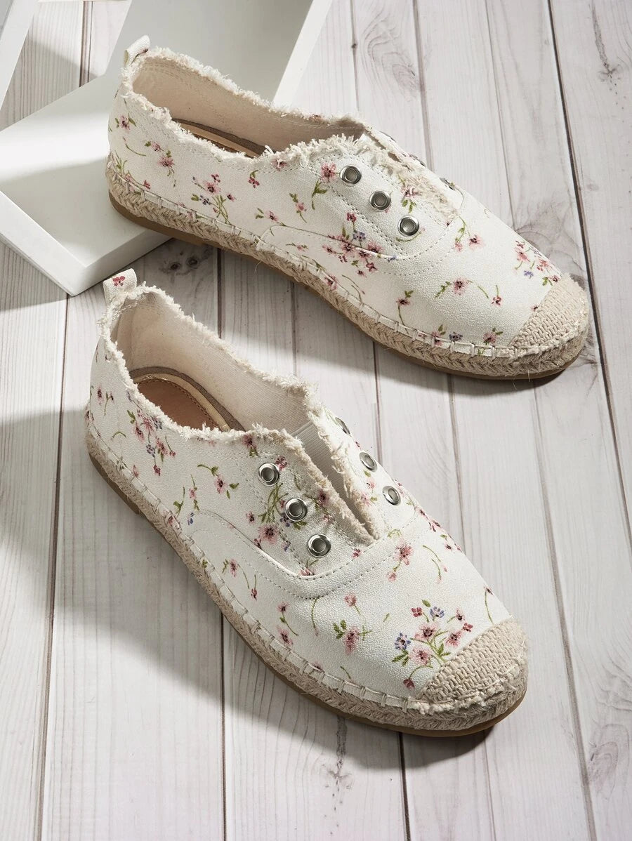 Step into effortless elegance with these charming ditsy floral print espadrille flats. Featuring a delicate botanical design, these versatile shoes blend timeless style with modern comfort, making them the perfect companion for your fall and winter getaways. The soft, breathable espadrille construction keeps your feet comfortable during long days of exploring, while the flat sole provides stability for casual strolls through cobblestone streets or seaside promenades. 