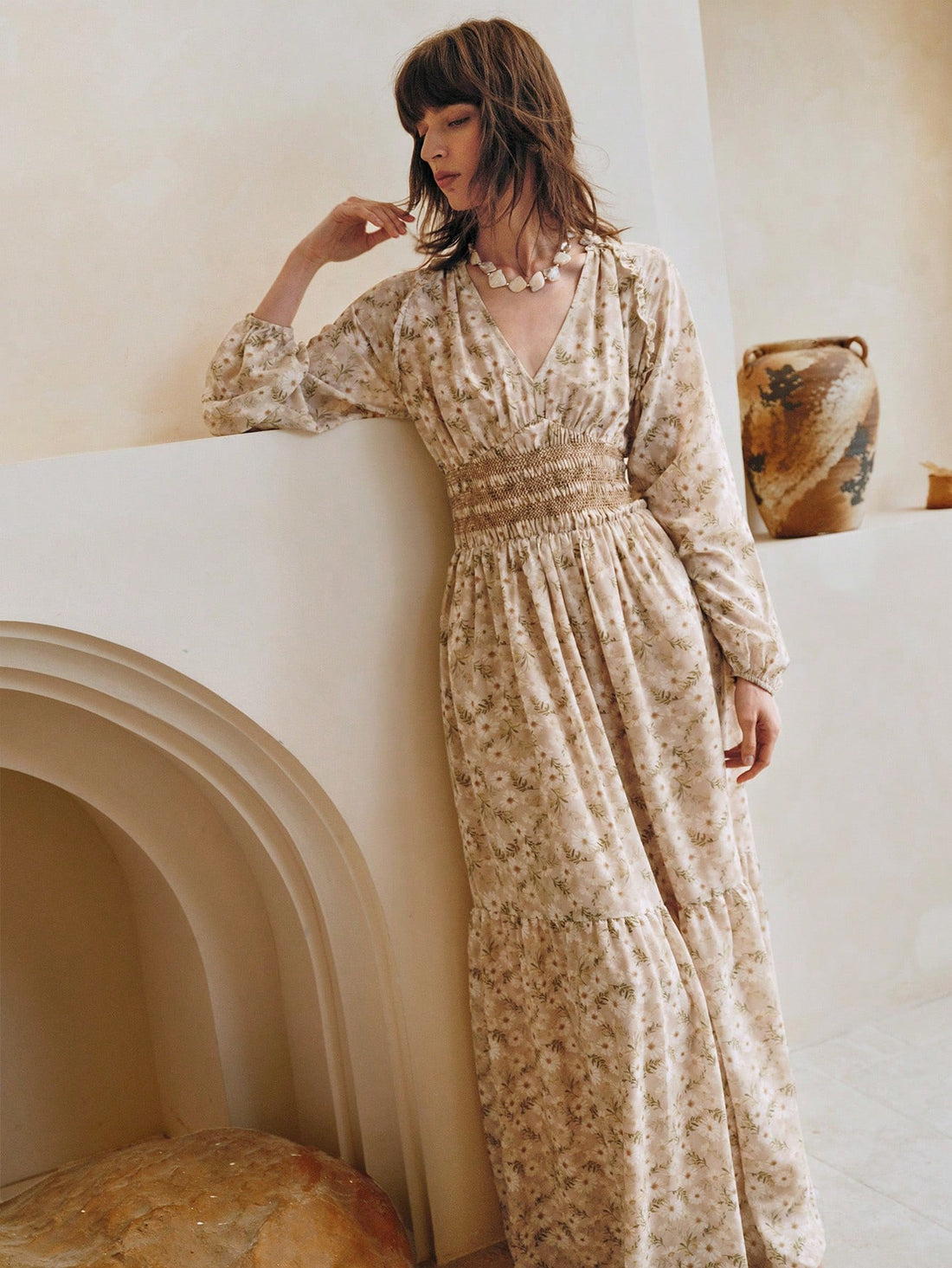 Step into summer with this playful ditsy floral dress, featuring charming ruffles and long sleeves for a breezy yet covered look. Its flattering A-line silhouette moves with you, making it perfect for sunny days and spontaneous adventures. Effortless style meets comfort in this must-have dress that brightens any occasion.