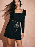 Get ready to turn heads with our Chic Elegance dress! This black puffy sleeve dress features a stunning diamond bow belt, perfect for adding an extra touch of style to any occasion. Embrace your unique and playful side with this must-have dress.