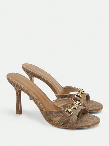 Introducing our Chic Elegance: Brown Stiletto Mule Sandals with Metal Accents! These stylish and versatile sandals are perfect for any occasion. The elegant design features a sleek stiletto heel and unique metal accents that add a touch of sophistication. Step out in style and make a statement with these chic mules.